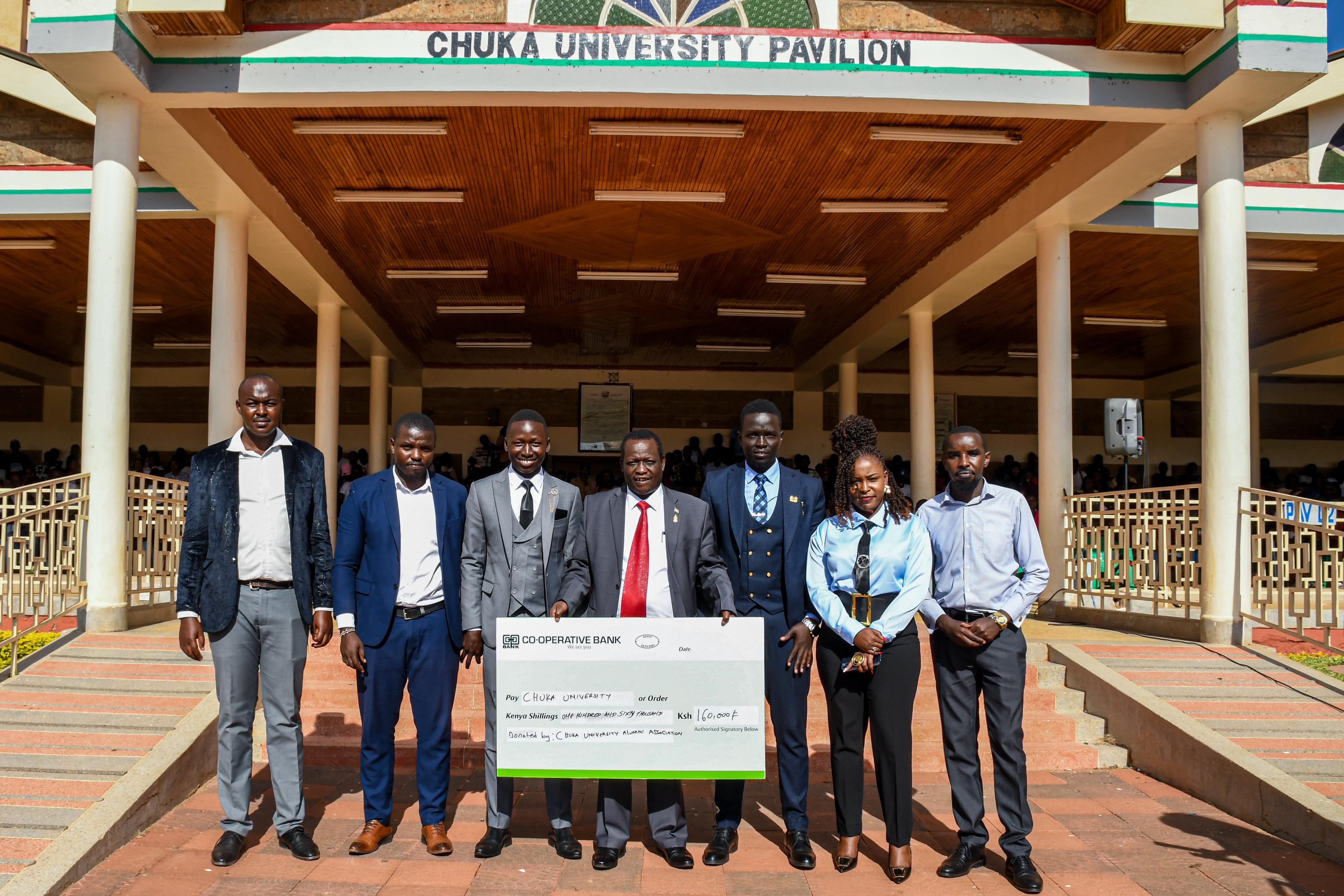 Prof. Mutembei(VC) poses for a photo with Mr. Livan Njeru(Secretary General), Mr. Anthony Kimani(Treasurer), Ms. Lucy Wambui(Org. sec), Mr. James Wainaina(Male Rep.), and Mr. Wilfred Rutto(Chapter coordinator) and Mr. Ben Geoffrey(Cusa Chair) after receiving the cheque.